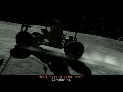 A silhouetted lunar rover navigates a rocky terrain under a starry sky, embarking on its sci-fi journey. The caption reads: Hows the rover doing - over? Complaining about the lunar seismic activities. Featuring in The Ward Microsoft Windows PC CD.