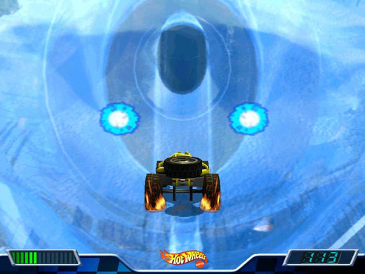 A 2000 Hot Wheels - Stunt Track Driver 2 - GET N DIRTY game features a toy car racing on a blue icy track with glowing circular lights, akin to a spinning disc. Dashboard elements appear at the bottom of the screen.