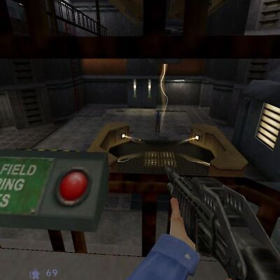 A first-person video game scene features a character holding a gently used shotgun in a dimly lit industrial room with stairs and railings around a red button panel, evoking the vibe of Half-Life Blue Shift 2001 for Microsoft Windows PC CD by Valve and Gearbox.