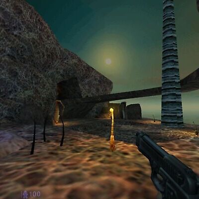 In Half-Life Blue Shift (2001, PC CD by Valve Gearbox), players navigate a rocky alien landscape with glowing structures from a first-person view. A CD disc icon signals hidden data, while a weapon in the foreground intensifies the experience in this gently used virtual world.