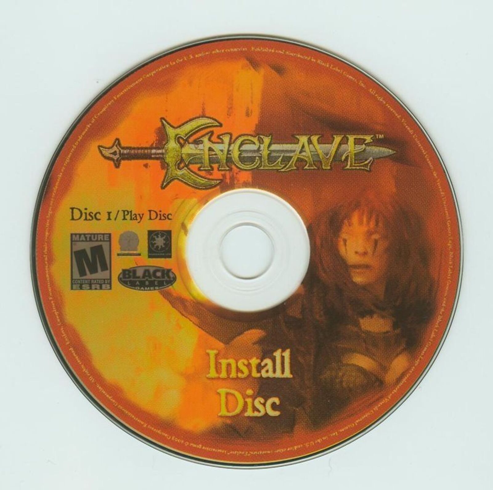Image of the Enclave Microsoft Windows PC CD install disc in a paper sleeve. The gently used orange CD features a warrior illustration, with visible ratings and logo info.