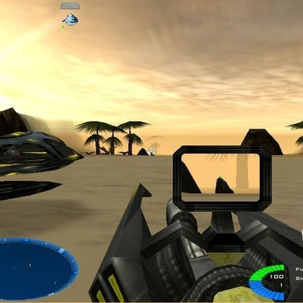 In Battlezone II: Combat Commander (1999, Microsoft Windows), the game offers a first-person shooter experience with a gun viewfinder aimed at palm trees on sandy terrain. Enhanced graphics display a circular HUD with health and ammo icons, set against a sky with a hazy yellow glow.