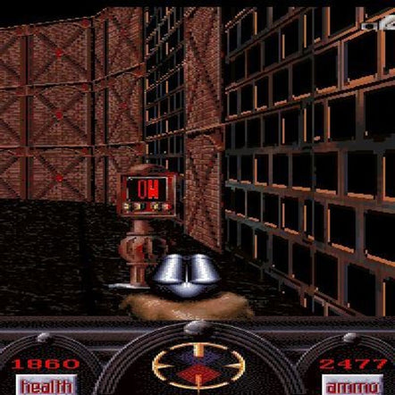 A first-person view of Angst: Rahzs Revenge 1996 reveals my trusty robot navigating through grid-patterned walls. Nearby, a used CD in a paper sleeve holds secrets to refill my health and ammo meters.