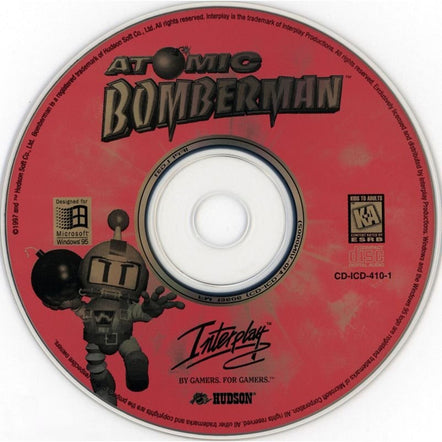 Pre-owned red CD for Atomic Bomberman with artwork and cartoon character. Comes in a paper sleeve featuring Interplay, Hudson logos, and compatible with Microsoft Windows 95. Product: Atomic Bomberman Microsoft Windows PC CD. CD-ID: CD-ICD-410-1.